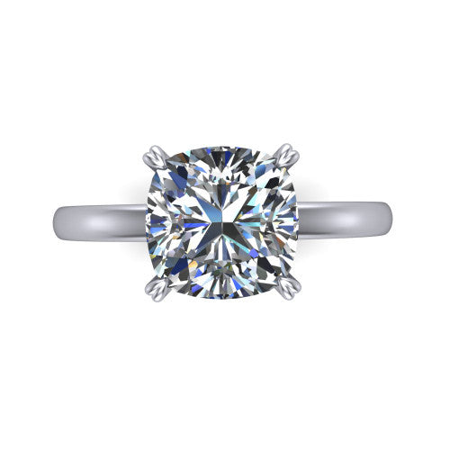 Leilani cushion solitaire engagement ring in Platinum with double-prong head on a plain band, top-down view of the double-prong head on a plain band
