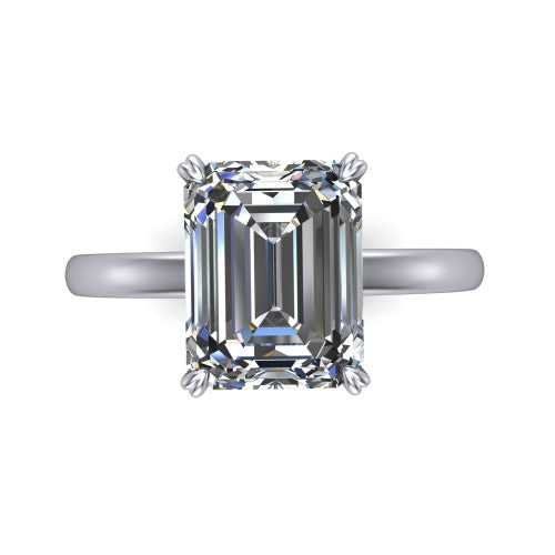 Leilani emerald solitaire engagement ring in Platinum with double-prong head on a plain band, top-down view of the double-prong head on a plain band