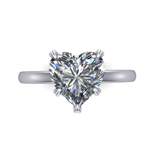 Leilani heart solitaire engagement ring in 18K White Gold with double-prong head on a plain band, top-down view of the double-prong head on a plain band