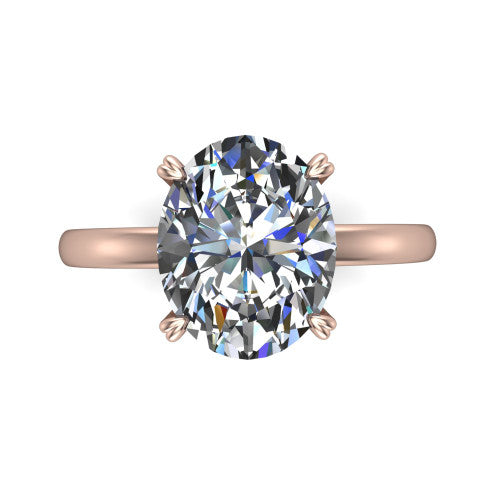 Leilani oval solitaire engagement ring in 18K Rose Gold with double-prong head on a plain band, top-down view of the double-prong head on a plain band