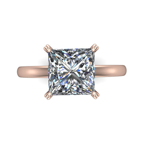 Leilani princess solitaire engagement ring in 14K Rose Gold with double-prong head on a plain band, top-down view of the double-prong head on a plain band