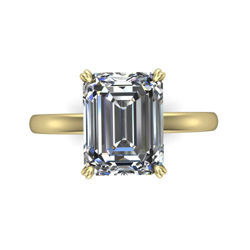 Leilani emerald solitaire engagement ring in 18K Yellow Gold with double-prong head on a plain band, top-down view of the double-prong head on a plain band