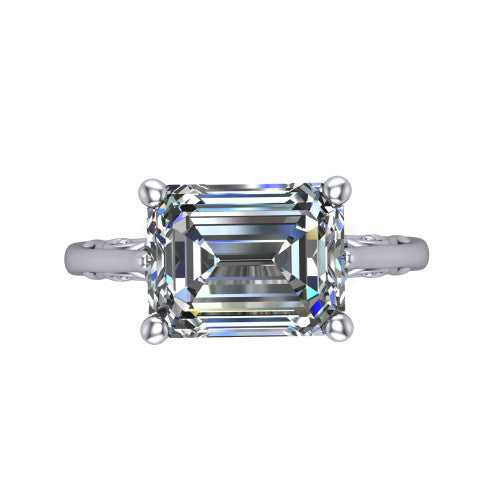 Genesis emerald vintage solitaire engagement ring in 18K White Gold with filigree scrollwork band, top-down view of the four-prong center and filigree shoulders