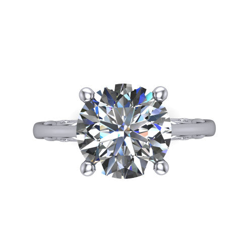 Genesis round vintage solitaire engagement ring in 18K White Gold with filigree scrollwork band, top-down view of the four-prong center and filigree shoulders