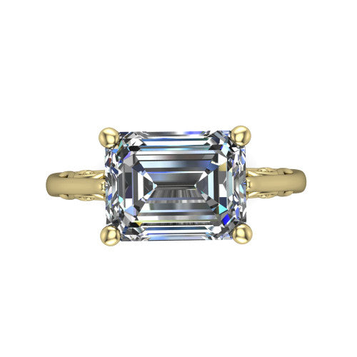 Genesis emerald vintage solitaire engagement ring in 18K Yellow Gold with filigree scrollwork band, top-down view of the four-prong center and filigree shoulders