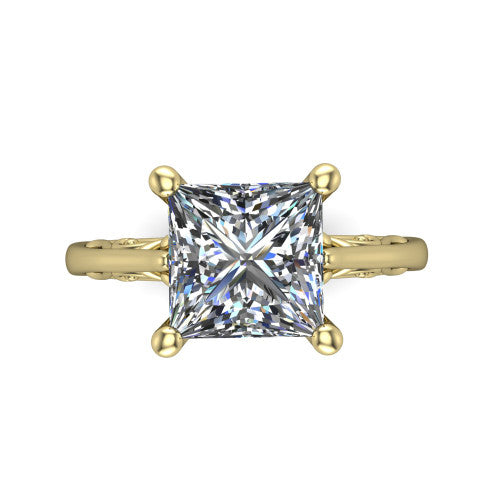 Genesis princess vintage solitaire engagement ring in 14K Yellow Gold with filigree scrollwork band, top-down view of the four-prong center and filigree shoulders