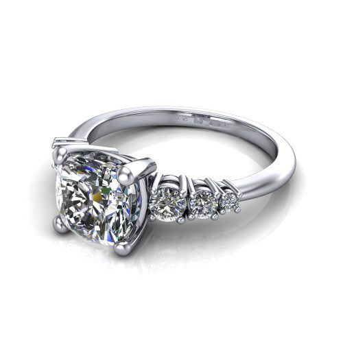 Emery cushion accent engagement ring in 14K White Gold with graduated round side stones, three-quarter perspective view