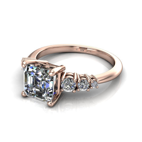 Emery asscher accent engagement ring in 14K Rose Gold with graduated round side stones, three-quarter perspective view