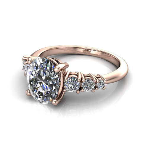 Emery oval accent engagement ring in 14K Rose Gold with graduated round side stones, three-quarter perspective view
