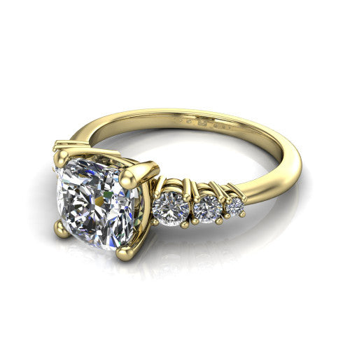 Emery cushion accent engagement ring in 18K Yellow Gold with graduated round side stones, three-quarter perspective view