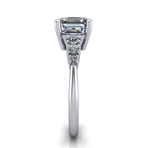 Emery asscher accent engagement ring in Platinum with graduated round side stones, side profile showing the graduated side stones and plain band