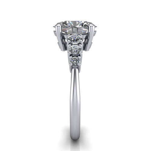 Emery oval accent engagement ring in 18K White Gold with graduated round side stones, side profile showing the graduated side stones and plain band