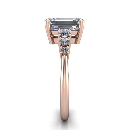 Emery emerald accent engagement ring in 14K Rose Gold with graduated round side stones, side profile showing the graduated side stones and plain band