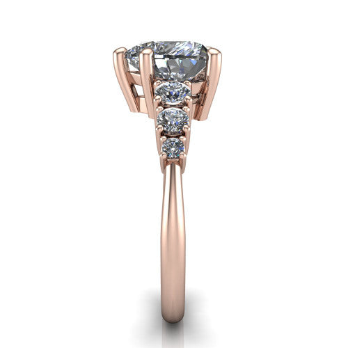 Emery heart accent engagement ring in 14K Rose Gold with graduated round side stones, side profile showing the graduated side stones and plain band