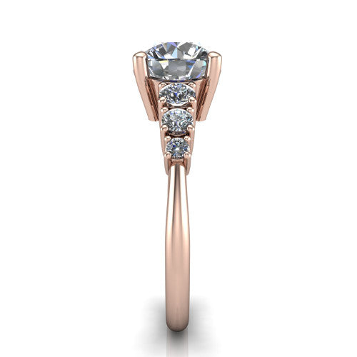 Emery round accent engagement ring in 18K Rose Gold with graduated round side stones, side profile showing the graduated side stones and plain band