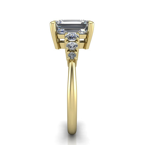 Emery emerald accent engagement ring in 14K Yellow Gold with graduated round side stones, side profile showing the graduated side stones and plain band