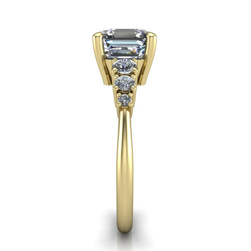 Emery asscher accent engagement ring in 14K Yellow Gold with graduated round side stones, side profile showing the graduated side stones and plain band