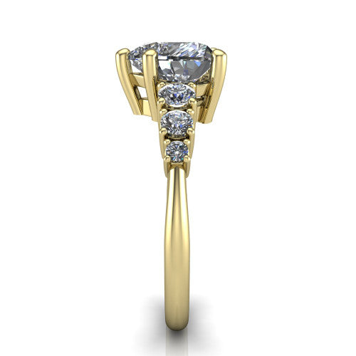 Emery heart accent engagement ring in 14K Yellow Gold with graduated round side stones, side profile showing the graduated side stones and plain band