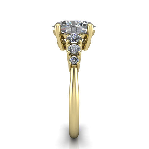 Emery oval accent engagement ring in 18K Yellow Gold with graduated round side stones, side profile showing the graduated side stones and plain band