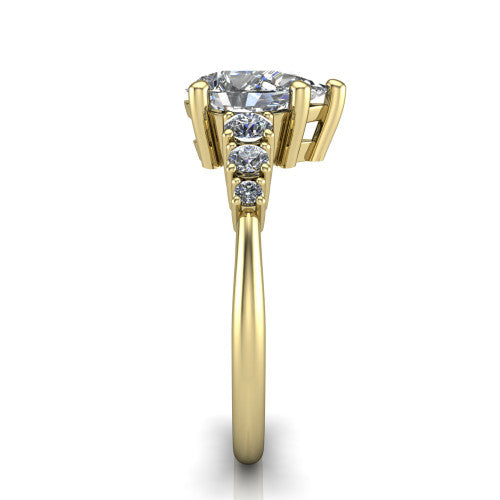 Emery pear accent engagement ring in 18K Yellow Gold with graduated round side stones, side profile showing the graduated side stones and plain band