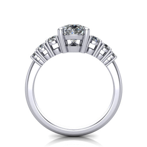 Emery pear accent engagement ring in 18K White Gold with graduated round side stones, through-finger front profile