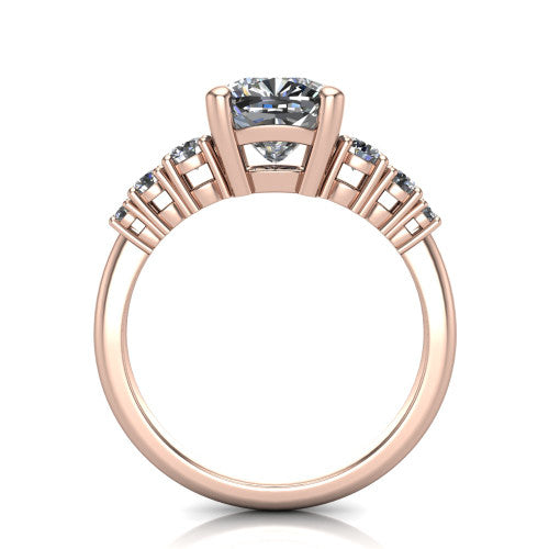 Emery cushion accent engagement ring in 18K Rose Gold with graduated round side stones, through-finger front profile