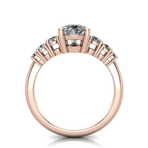 Emery pear accent engagement ring in 18K Rose Gold with graduated round side stones, through-finger front profile