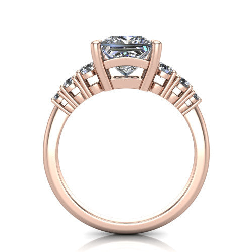 Emery princess accent engagement ring in 18K Rose Gold with graduated round side stones, through-finger front profile