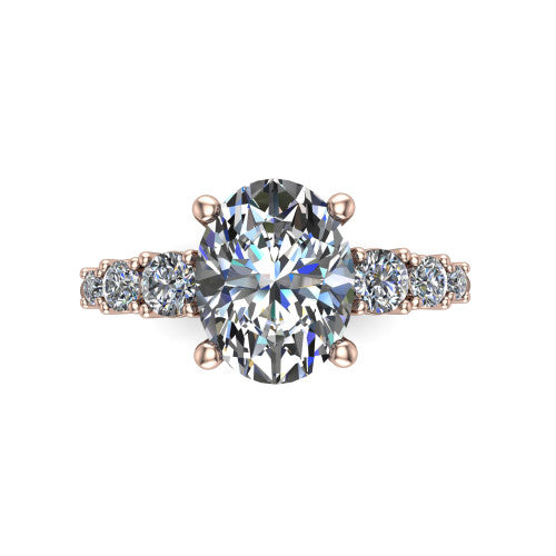 Emery oval accent engagement ring in 18K Rose Gold with graduated round side stones, top-down view of the center and graduated round side accents