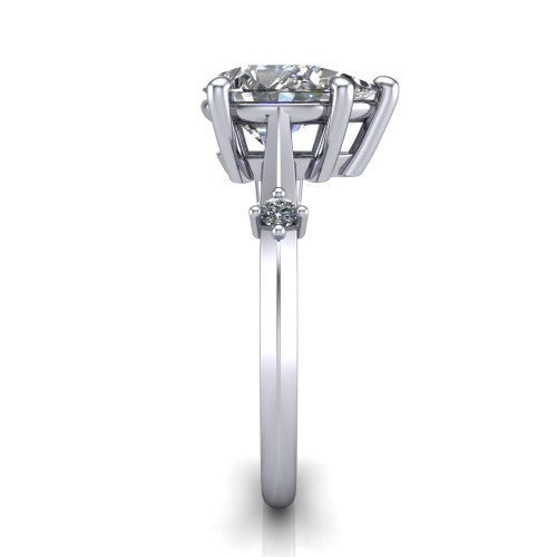 Raelynn pear accent engagement ring in 14K White Gold with kite-set geometric side stones, side profile showing the plain band and kite-set side accent