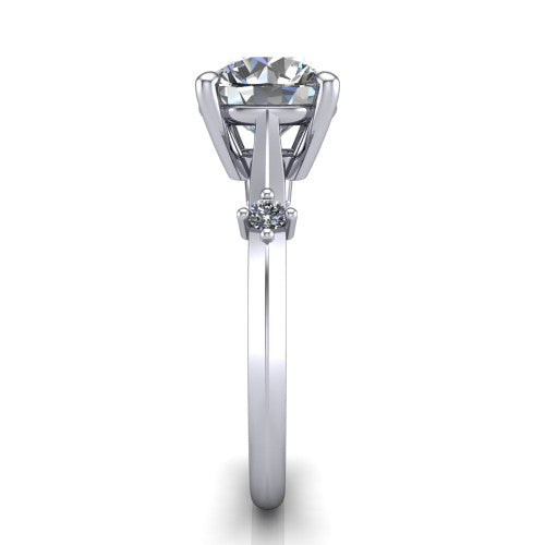 Raelynn round accent engagement ring in 18K White Gold with kite-set geometric side stones, side profile showing the plain band and kite-set side accent