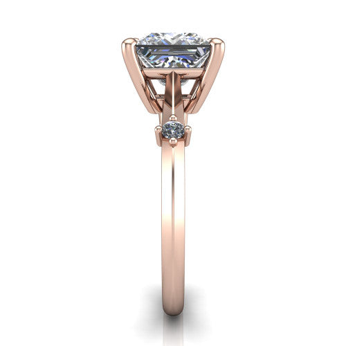 Raelynn princess accent engagement ring in 18K Rose Gold with kite-set geometric side stones, side profile showing the plain band and kite-set side accent