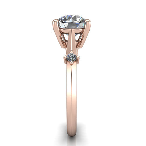 Raelynn round accent engagement ring in 18K Rose Gold with kite-set geometric side stones, side profile showing the plain band and kite-set side accent