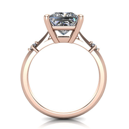 Raelynn princess accent engagement ring in 18K Rose Gold with kite-set geometric side stones, through-finger front profile