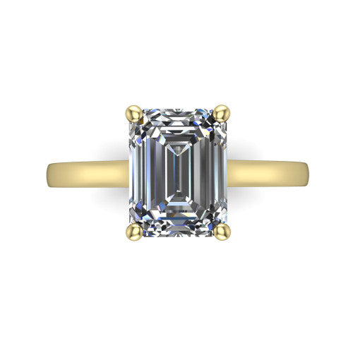 Samantha emerald engraved solitaire engagement ring in 14K Yellow Gold with scrollwork band, top-down view of the four-prong center and engraved band