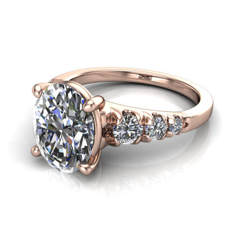Millie oval accent engagement ring in 14K Rose Gold with graduated round side stones, three-quarter perspective view
