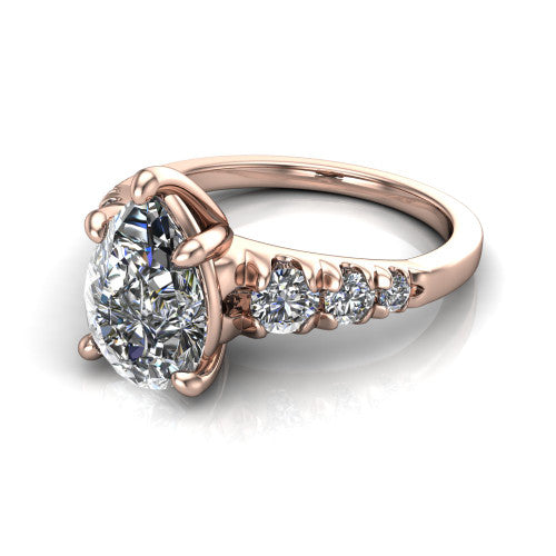 Millie pear accent engagement ring in 18K Rose Gold with graduated round side stones, three-quarter perspective view