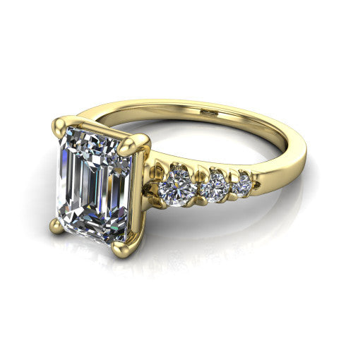 Millie emerald accent engagement ring in 18K Yellow Gold with graduated round side stones, three-quarter perspective view
