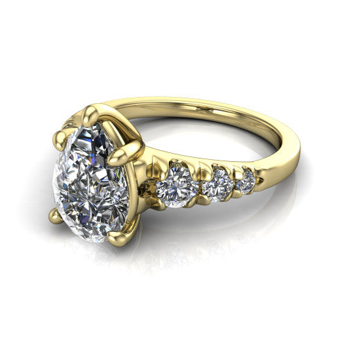 Millie pear accent engagement ring in 18K Yellow Gold with graduated round side stones, three-quarter perspective view