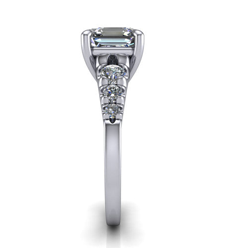 Millie asscher accent engagement ring in Platinum with graduated round side stones, side profile showing the graduated side stones and plain band