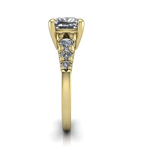 Millie cushion accent engagement ring in 18K Yellow Gold with graduated round side stones, side profile showing the graduated side stones and plain band