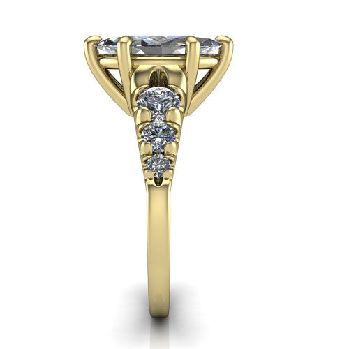 Millie marquise accent engagement ring in 14K Yellow Gold with graduated round side stones, side profile showing the graduated side stones and plain band