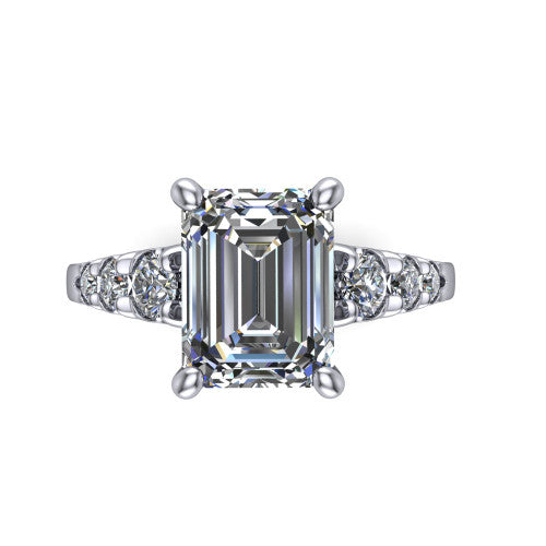 Millie emerald accent engagement ring in Platinum with graduated round side stones, top-down view of the center and graduated round side stones