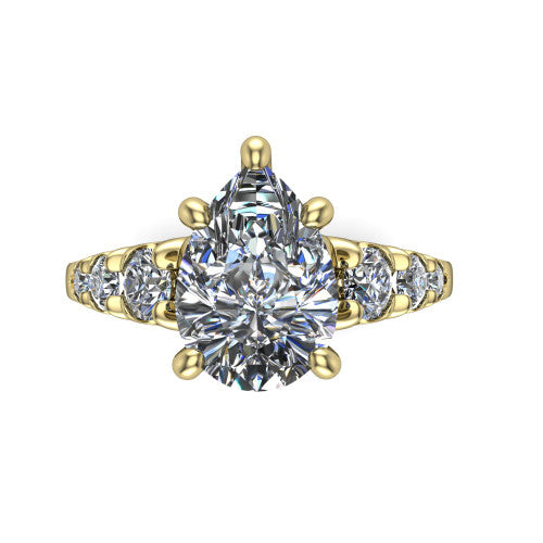 Millie pear accent engagement ring in 14K Yellow Gold with graduated round side stones, top-down view of the center and graduated round side stones