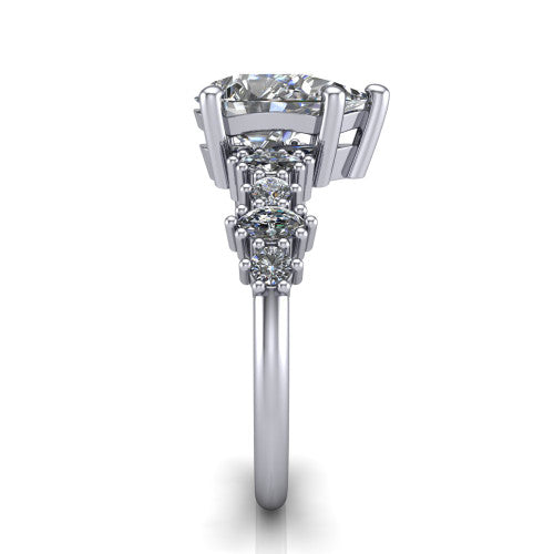 Piper pear cluster accent engagement ring in 18K White Gold with marquise-and-round side stones, side profile showing the plain band and side accent cluster