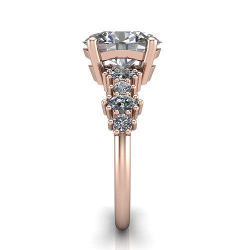 Piper oval cluster accent engagement ring in 18K Rose Gold with marquise-and-round side stones, side profile showing the plain band and side accent cluster