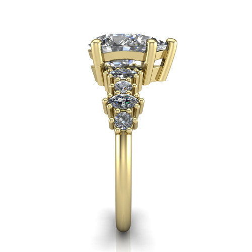 Piper pear cluster accent engagement ring in 18K Yellow Gold with marquise-and-round side stones, side profile showing the plain band and side accent cluster