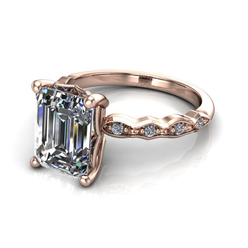 Cassie emerald vintage station engagement ring in 18K Rose Gold with marquise milgrain band and bezel accents, three-quarter perspective view
