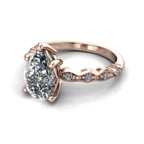 Cassie pear vintage station engagement ring in 14K Rose Gold with marquise milgrain band and bezel accents, three-quarter perspective view