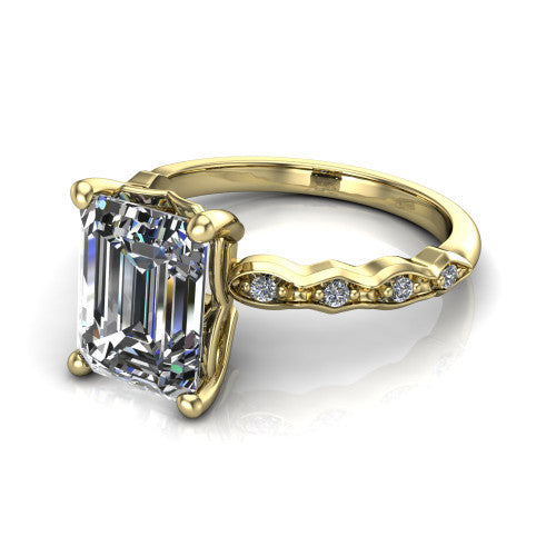 Cassie emerald vintage station engagement ring in 14K Yellow Gold with marquise milgrain band and bezel accents, three-quarter perspective view